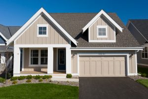 Modern home with white board and batten siding and black trim